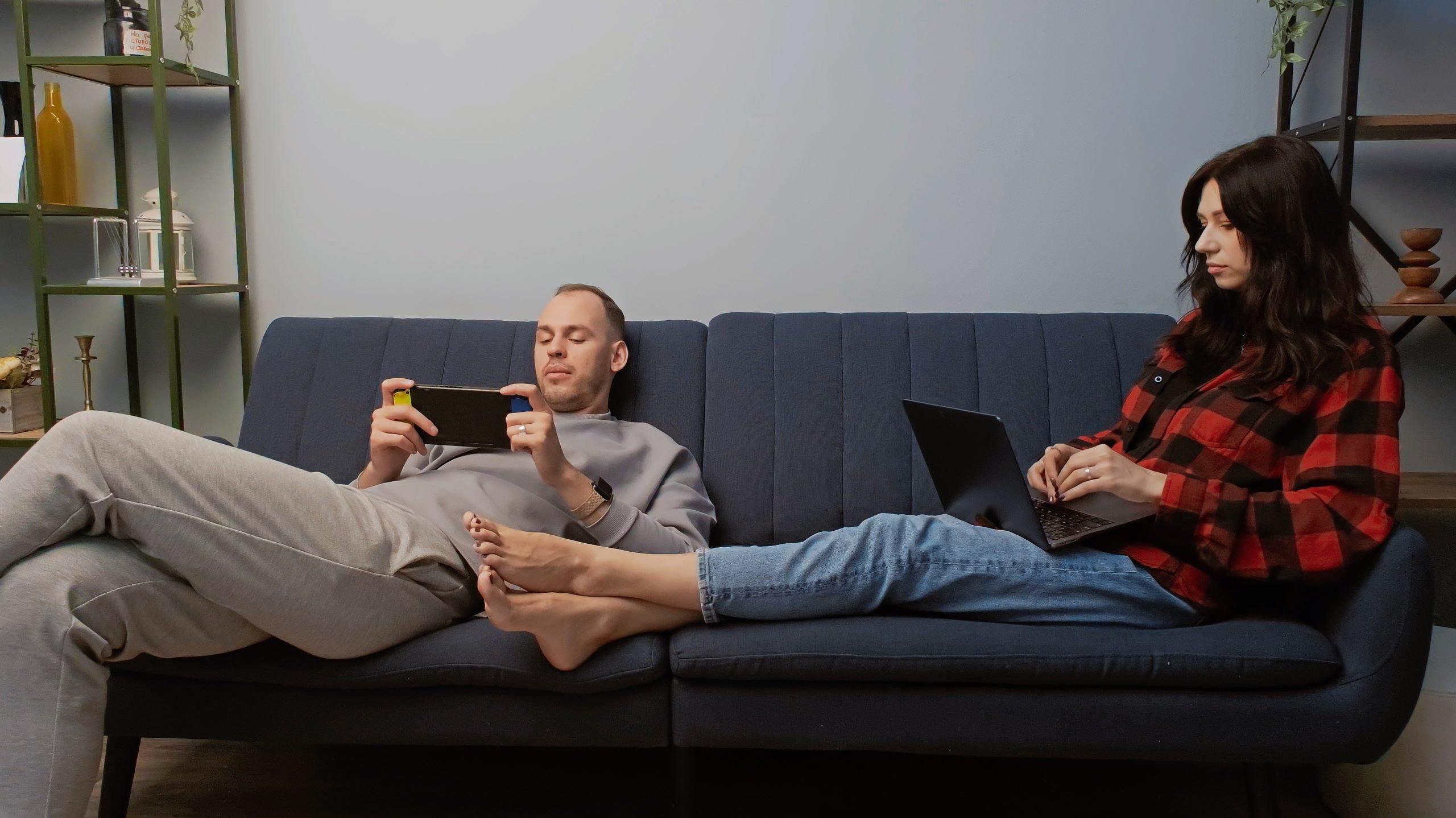 Social,Trend.,Young,Couple,Sharing,Time,Together,With,Gadgets,Sitting