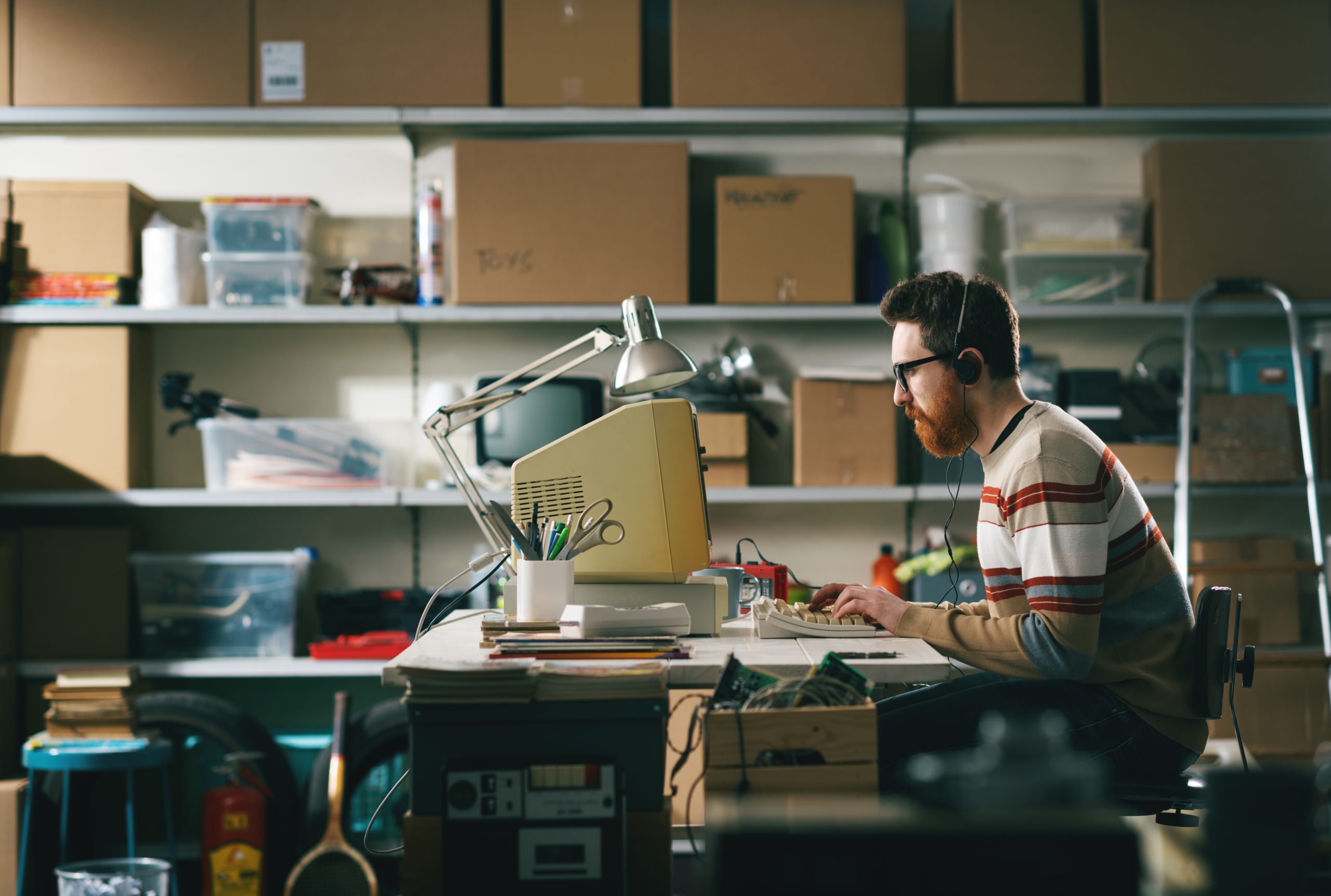 Vintage,Style,Programmer,Sitting,At,His,Desk,And,Working,With Vintage,Style,Programmer,Sitting,At,His,Desk,And,Working,With